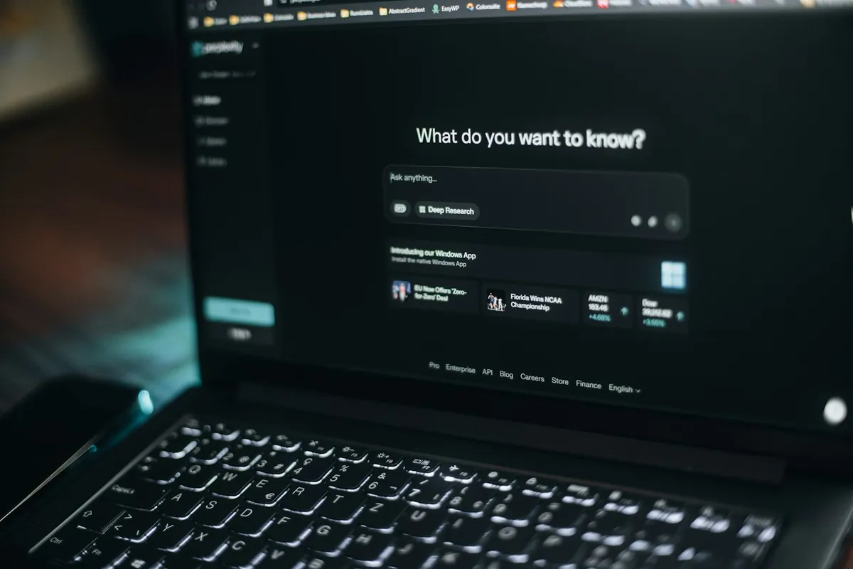 Laptop displaying an AI search interface and question box