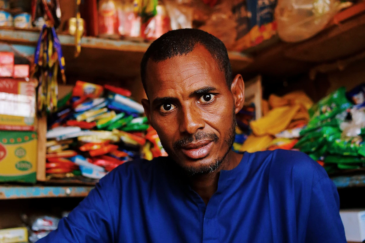A neighborhood shop owner working in a local business